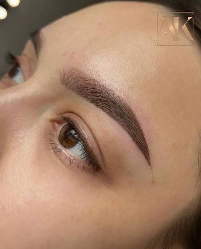 Close-up of a freshly laminated and tinted brow