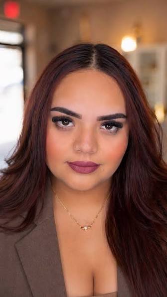 Client wearing a volume lash set and defined brows